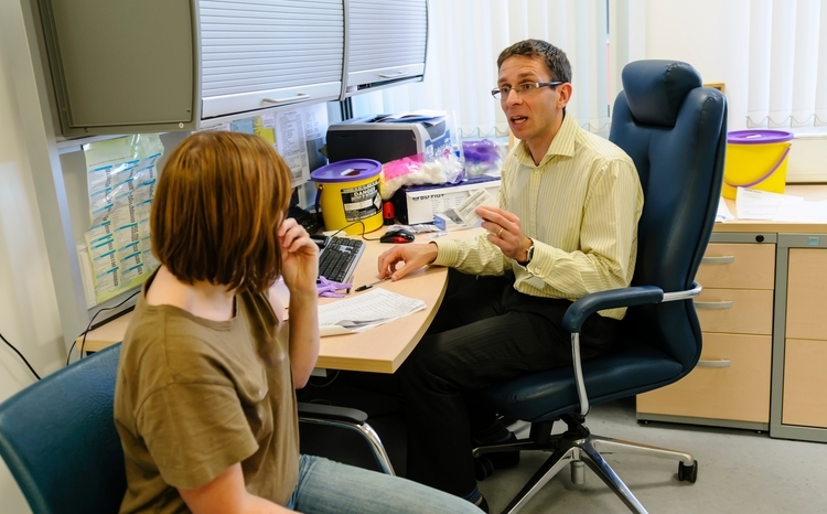 Doctor and Patient in a consulting room at a GP surgery